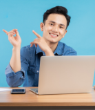 A team member is laughing, holding a book on their chair with their hand on the side, while our team provides expert SEO services in Delhi